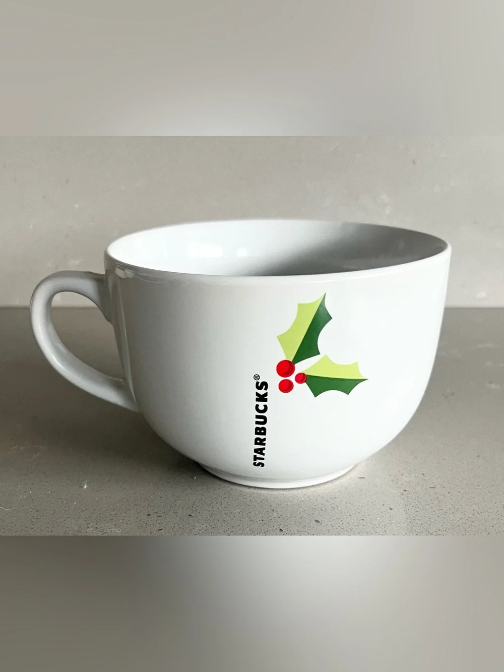 Starbucks holiday mug is in excellent condition. White oversized mug reads STARB